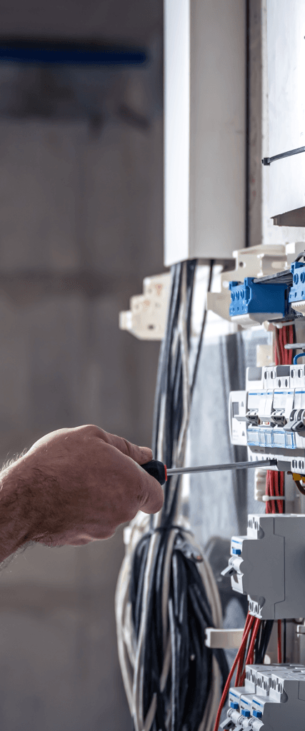 electrician working on electrical panel