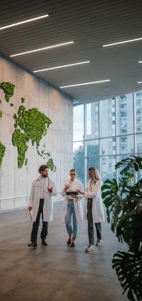 Medical Staff Discussing Cases in Modern Hospital Lobby